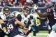HOUSTON, TX - JANUARY 03: J.J. Watt #99 of the Houston Texans strips the ball from Blake Bortles #5 of the Jacksonville Jaguars into the hands of Whitney Mercilus #59 of the Houston Texans for an interception in the fourth quarter on January 3, 2016 at NR