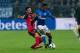GELSENKIRCHEN, GERMANY - DECEMBER 17: Onur Bulut of Freiburg and Abdul Rahman Baba of Schalke battle for the ball during the Bundesliga match between FC Schalke 04 and SC Freiburg at Veltins-Arena on December 17, 2016 in Gelsenkirchen, Germany. (Photo by