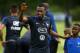 France's midfielder Blaise Matuidi (L) reacts with a young player before a training session in Clairefontaine-en-Yvelines near Paris on June 11, 2017, two days before a friendly football match against England. / AFP PHOTO / FRANCK FIFE (Photo cred