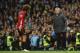 Manchester United's Belgian midfielder Marouane Fellaini (L) reacts to Manchester United's Portuguese manager Jose Mourinho (R) as he leaves the pitch after being sent off during the English Premier League football match between Manchester City and Manche