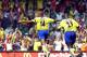 Arsenal's French Thierry Henry (14) celebrates after scoring a goal against Manchester United with teammate Sol Campbell during the FA Community Shield soccer match 10 August, 2003 in Cardiff, Wales, UK. AFP PHOTO/NICOLAS ASFOURI (Photo credit should