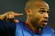 ROME, ITALY: Jubilation of Arsenal forward French Thierry Henry after he scored during the 2nd round Champions League, Group B, match AS Roma - Arsenal, 27 November 2002, at the Rome's Olympic Stadium. AFP PHOTO GABRIEL BOUYS (Photo credit should read G