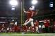Carson Palmer warms up before playing the Raiders.