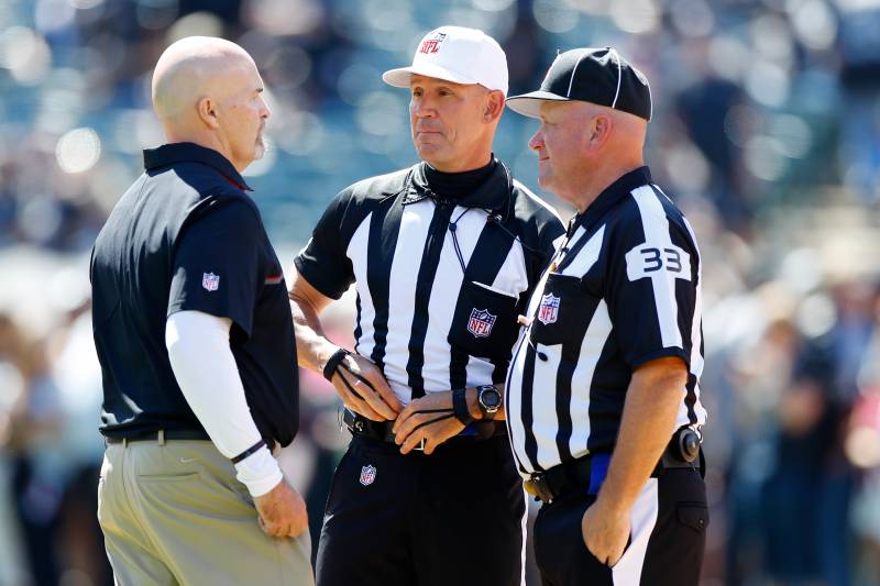 OAKLAND, CA - SEPTEMBER 18: Head coach Dan Quinn of the Atlanta Falcons speaks with referee Clete Blakeman and field judge Steve Zimmer prior to their NFL game against the Oakland Raiders at Oakland-Alameda County Coliseum on September 18, 2016 in Oakla