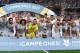 Real Madrid's defender Sergio Ramos (C) holds the trophy as he and teammates celebrate their Supercup after winning the second leg of the Spanish Supercup football match Real Madrid vs FC Barcelona at the Santiago Bernabeu stadium in Madrid, on August 16,