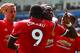 Manchester United's French midfielder Paul Pogba (R) celebrates with Manchester United's Belgian striker Romelu Lukaku (L) scoring the team's fourth goal during the English Premier League football match between Swansea City and Manchester United at The Li