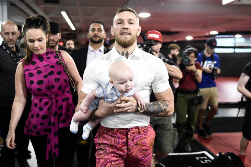 LAS VEGAS, NV - AUGUST 11: UFC lightweight champion Conor McGregor carries his son Conor McGregor Junior during a media workout at the UFC Performance Institute on August 11, 2017 in Las Vegas, Nevada. McGregor will fight Floyd Mayweather Jr. in a boxing