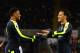 SWANSEA, WALES - JANUARY 14: Alex Iwobi of Arsenal (L) celebrates his sides third goal with Mesut Ozil of Arsenal (R) during the Premier League match between Swansea City and Arsenal at Liberty Stadium on January 14, 2017 in Swansea, Wales. (Photo by To