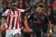 STOKE ON TRENT, ENGLAND - AUGUST 19: Alex Oxlade-Chamberlain of Arsenal moves away from Saido Berahino during the Premier League match between Stoke City and Arsenal at Bet365 Stadium on August 19, 2017 in Stoke on Trent, England. (Photo by David Rogers