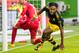 Dortmund's Gabonese forward Pierre-Emerick Aubameyang (R) celebrates scoring his side's third goal past Wolfsburg's Belgian goalkeeper Koen Casteels during the German First division Bundesliga football match VfL Wolfsburg v BVB Borussia Dortmund in Wolfsb