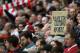 A fan holds up a placard in support of Liverpool's Brazilian midfielder Philippe Coutinho during the English Premier League football match between Liverpool and Crystal Palace at Anfield in Liverpool, north west England on August 19, 2017. / AFP PHOTO / O