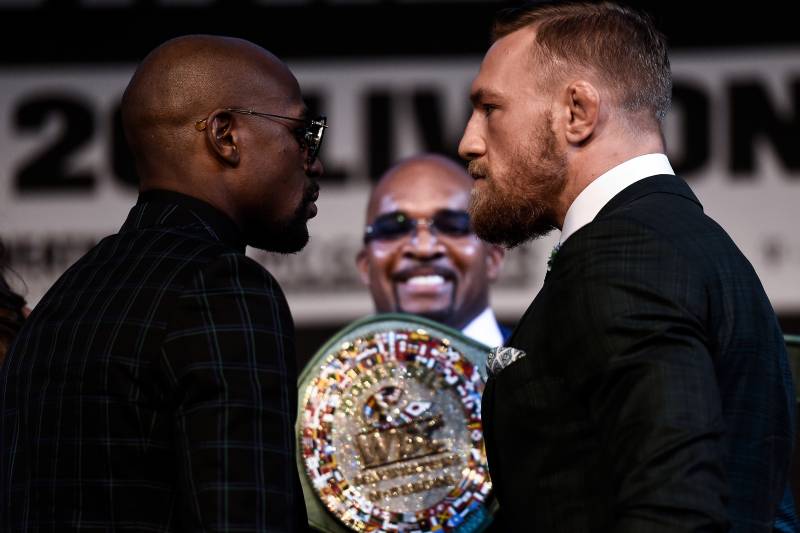 LAS VEGAS, NV - AUGUST 23: (L-R) Boxer Floyd Mayweather Jr. and UFC lightweight champion Conor McGregor face off during a news conference at the KA Theatre at MGM Grand Hotel & Casino on August 23, 2017 in Las Vegas, Nevada. The two will meet in a super 