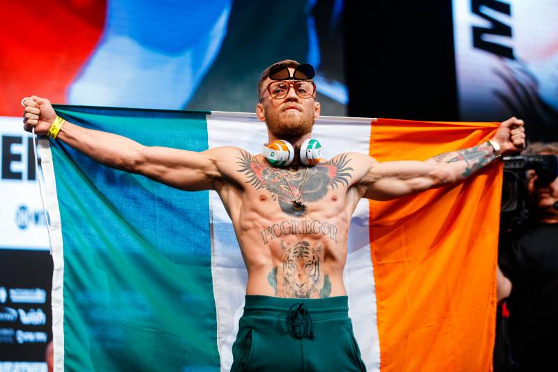 Aug 25, 2017; Las Vegas, NV, USA; Conor McGregor holds the Irish flag of Ireland during weigh ins for the upcoming boxing match at T-Mobile Arena. Mandatory Credit: Mark J. Rebilas-USA TODAY Sports