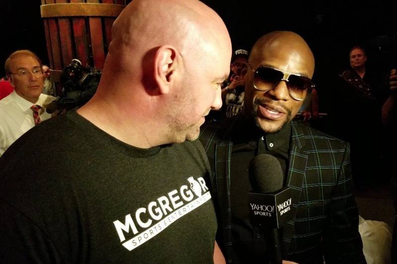 Mayweather and White share a moment backstage.