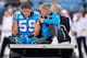 Linebacker Luke Kuechly is driven off the field after suffering a concussion in November 2016.