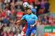 Arsenal's English midfielder Alex Oxlade-Chamberlain (R) vies with Liverpool's Spanish defender Alberto Moreno during the English Premier League football match between Liverpool and Arsenal at Anfield in Liverpool, north west England on August 27, 2017. /