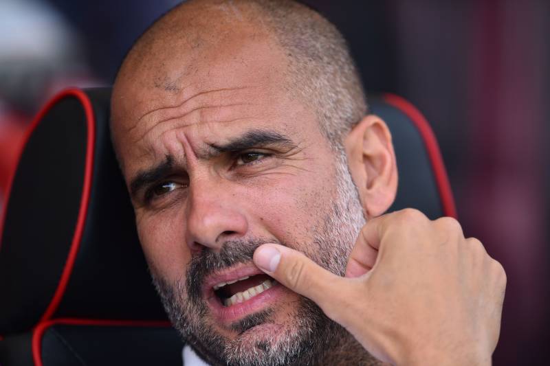 Manchester City's Spanish manager Pep Guardiola gestures as he awaits kick off ahead of the English Premier League football match between Bournemouth and Manchester City at the Vitality Stadium in Bournemouth, southern England on August 26, 2017. / AFP PH