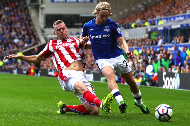 LIVERPOOL, ENGLAND - AUGUST 12: Tom Davies of Everton is tackled by Ryan Shawcross of Stoke City during the Premier League match between Everton and Stoke City at Goodison Park on August 12, 2017 in Liverpool, England. (Photo by Chris Brunskill Ltd/Getty 