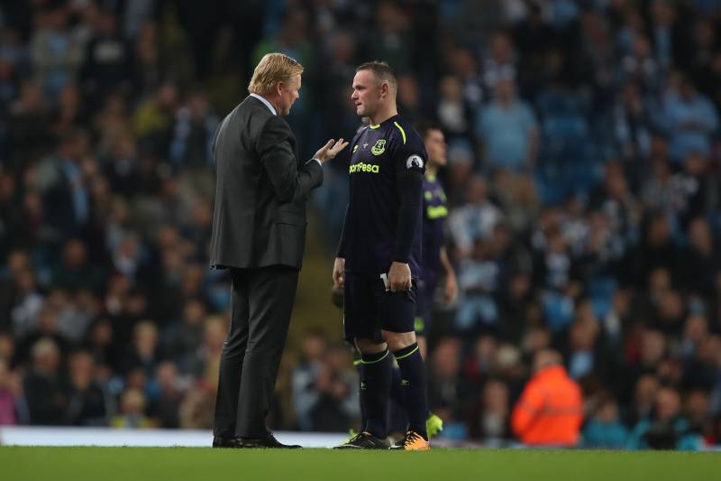 MANCHESTER, ENGLAND - AUGUST 21: Ronald Koeman head coach / manager of Everton speaks to Wayne Rooney of Everton during the Premier League match between Manchester City and Everton at Etihad Stadium on August 21, 2017 in Manchester, England. (Photo by Rob