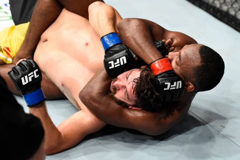 ROTTERDAM, NETHERLANDS - SEPTEMBER 02: (R-L) Leon Edwards of Jamaica attempts to submit Bryan Barberena in their welterweight bout during the UFC Fight Night event at the Rotterdam Ahoy on September 2, 2017 in Rotterdam, Netherlands. (Photo by Josh Hedge