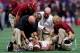 ATLANTA, GA - SEPTEMBER 02: Deondre Francois #12 of the Florida State Seminoles is attended to by medical personnel after being injured in the fourth quarter of their game against the Alabama Crimson Tide at Mercedes-Benz Stadium on September 2, 2017 in