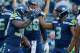 SEATTLE, WA - AUGUST 25: Running back Tre Madden #38 of the Seattle Seahawks is congratulated by quarterback Russell Wilson #3 after scoring a touchdown against the Kansas City Chiefs at CenturyLink Field on August 25, 2017 in Seattle, Washington. (Photo