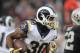 Aug 19, 2017; Oakland, CA, USA; Los Angeles Rams running back Todd Gurley (30) rushes against the Oakland Raiders during the first half of a NFL football game at Oakland-Alameda County Coliseum. Mandatory Credit: Kirby Lee-USA TODAY Sports