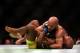 KANSAS CITY, MO - APRIL 15: Demetrious Johnson (top) takes down Wilson Reis (bottom) during their Flyweight Championship bout on UFC Fight Night at the Sprint Center on April 15, 2017 in Kansas City, Missouri. (Photo by Jamie Squire/Getty Images)
