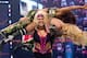 Beth Phoenix hoists up both Michelle McCool and Layla El.