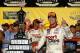 DARLINGTON, SC - SEPTEMBER 03: Denny Hamlin, driver of the #11 Sport Clips Toyota, poses with the trophy in Victory Lane after winning the Monster Energy NASCAR Cup Series Bojangles' Southern 500 at Darlington Raceway on September 3, 2017 in Darlington,