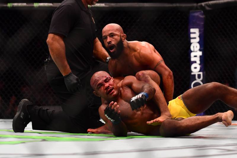 Apr 15, 2017; Kansas City, MO, USA; Demetrious Johnson (red) wins the fight over Wilson Reis (blue) fight during UFC Fight Night at Sprint Center. Mandatory Credit: Ron Chenoy-USA TODAY Sports