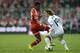 Bayern Munich's Austrian midfielder David Alaba (L) and Real Madrid's Croatian midfielder Luka Modric fight for the ball during the UEFA Champions League second-leg semi-final football match FC Bayern Munich vs Real Madrid CF in Munich, southern Germany,