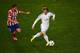 LISBON, PORTUGAL - MAY 24: Luka Modric of Real Madrid evades Gabi of Club Atletico de Madrid during the UEFA Champions League Final between Real Madrid and Atletico de Madrid at Estadio da Luz on May 24, 2014 in Lisbon, Portugal. (Photo by Lars Baron/Ge