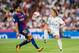 MADRID, SPAIN - AUGUST 16 - Luka Modric (r) of Real Madrid competes for the ball with Andre Filipe Tavares Gomes of FC Barcelona during their Supercopa de Espana Final 2nd Leg match between Real Madrid and FC Barcelona at the Estadio Santiago Bernabeu on