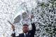 Real Madrid's defender Sergio Ramos holds up the trophy celebrating the team's win on Plaza Cibeles in Madrid on June 4, 2017 after the UEFA Champions League football match final Juventus vs Real Madrid CF held at the National Stadium of Wales in Cardiff
