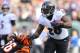 Jan 1, 2017; Cincinnati, OH, USA; Baltimore Ravens running back Terrance West (28) breaks a tackle from Cincinnati Bengals cornerback Josh Shaw (26) at Paul Brown Stadium. The Bengals won 27-10. Mandatory Credit: Aaron Doster-USA TODAY Sports