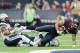 HOUSTON, TX - NOVEMBER 27: C.J. Fiedorowicz #87 of the Houston Texans is tackled by Dwight Lowery #20 of the San Diego Chargers and Craig Mager #29 at NRG Stadium on November 27, 2016 in Houston, Texas. (Photo by Bob Levey/Getty Images)