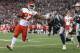 FOXBORO, MA - SEPTEMBER 07: Kareem Hunt #27 of the Kansas City Chiefs stiff arms Duron Harmon #30 of the New England Patriots as he runs for a 4-yard rushing touchdown during the fourth quarter against the New England Patriots at Gillette Stadium on Sept