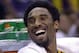 LOS ANGELES, UNITED STATES: Los Angeles Laker Kobe Bryant laughs with his teammates on the bench after coming out of the 24 November 2000 game against the Minnesota Timberwolves at the Staples Center in Los Angeles, CA. The Lakers beat the Timberwolves b