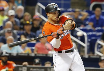 MIAMI, FL - SEPTEMBER 3:   Giancarlo Stanton #27 of the Miami Marlins swings and strikes out in the first inning against the Philadelphia Phillies at Marlins Park on September 3, 2017 in Miami, Florida.  (Photo by Joe Skipper/Getty Images)