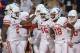 TUCSON, AZ - SEPTEMBER 09: Wide receiver Linell Bonner #15 of the Houston Cougars celebrates with Duke Catalon #2 and Keith Corbin #18 after scoring a five yard touchdown against the Arizona Wildcats in the first half at Arizona Stadium on September 9, 2