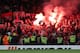 LONDON, ENGLAND - SEPTEMBER 14: Police look on as Cologne fans ignite flares and celebrate a goal during the UEFA Champions League group C match between Chelsea FC and Qarabag FK at Stamford Bridge on September 12, 2017 in London, United Kingdom. (Photo b