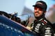 JOLIET, IL - SEPTEMBER 15: Martin Truex Jr., driver of the #78 Furniture Row/Denver Mattress Toyota, sits in his car during qualifying for the NASCAR Camping World Truck Series TheHouse.com 225 at Chicagoland Speedway on September 15, 2017 in Joliet, Ill