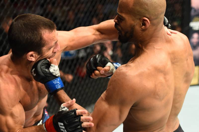 PITTSBURGH, PA - SEPTEMBER 16: (R-L) David Branch punches Luke Rockhold in their middleweight bout during the UFC Fight Night event inside the PPG Paints Arena on September 16, 2017 in Pittsburgh, Pennsylvania. (Photo by Josh Hedges/Zuffa LLC/Zuffa LLC v
