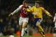 LONDON - FEBRUARY 10: Ray Parlour of Arsenal battles for the ball with Graeme Le Saux of Southampton during the FA Barclaycard Premiership match between Arsenal and Southampton at Highbury on February 10, 2004 in London. (Photo by Clive Mason/Getty Imag