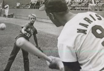 Roger Jr. playing a game of pepper with his father, Roger Maris.