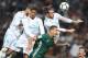 Real Madrid's defender from Spain Sergio Ramos (L), Real Madrid's defender from France Raphael Varane (2L) and Real Madrid's forward from Wales Gareth Bale (top R) vie with Real Betis' defender from Morocco Zou during the Spanish league football match Rea
