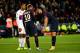 TOPSHOT - Paris Saint-Germain's Uruguayan forward Edinson Cavani (R) speaks with Paris Saint-Germain's Brazilian forward Neymar (C) during the French L1 football match between Paris Saint-Germain and Olympique Lyonnais at the Parc des Princes Stadium in P