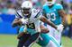 CARSON, CA - SEPTEMBER 17: Michael Thomas #31 of the Miami Dolphins tackles Keenan Allen #13 of the Los Angeles Chargers during the NFL game at the StubHub Center on September 17, 2017 in Carson, California. (Photo by Sean M. Haffey/Getty Images)