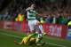 GLASGOW, SCOTLAND - AUGUST 16: Igor Shitov of FC Astana vies with Kieran Tierney of Celtic during the UEFA Champions League Qualifying Play-Offs Round First Leg match between Celtic FC and FK Astana at Celtic Park on August 16, 2017 in Glasgow, United Kin
